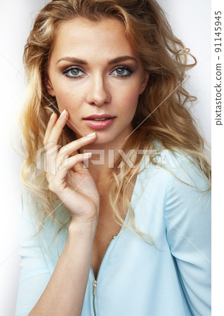 young pretty stylish blond girl posing emotional isolated on white background happy smiling cool smile, lifestyle people concept close up 91145945