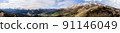 Panoramic landscape view, snow covered mountain peaks on mountain range. 91146049