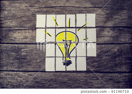Top view of hand drawn yellow light bulb assembled with many cards Top view of hand drawn yellow light bulb assembled with many cards 91146710