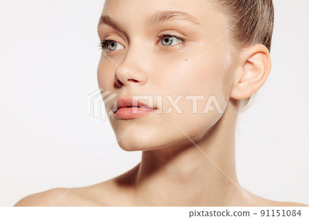 Portrait of young, beautiful and healthy girl with well-kept skin isolated on white background. The spa, surgery, face lifting and skin care concept Portrait of young, beautiful and healthy girl with well-kept skin isolated on white background. The spa, surgery, face lifting and skin care concept 91151084