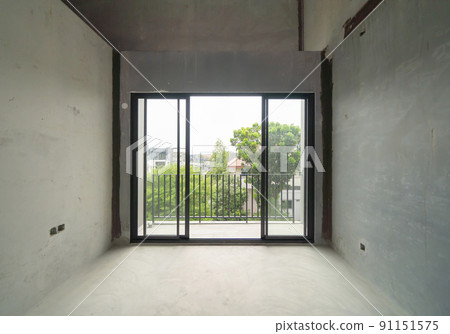 Empty under construction room in home or house with space on site. Interior. Old unfurnished room rental property, living space units. lifestyle. Renovation. 91151575