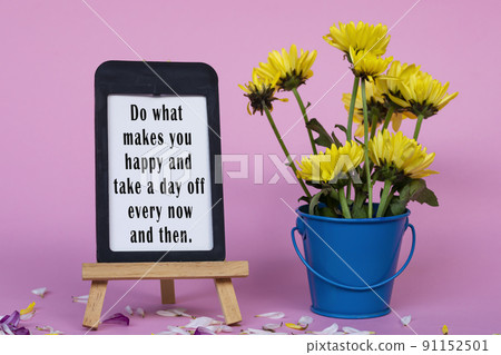 Motivational and inspirational quote on note paper with frame and flowers. Motivational and inspirational quote on note paper with frame and flowers. 91152501