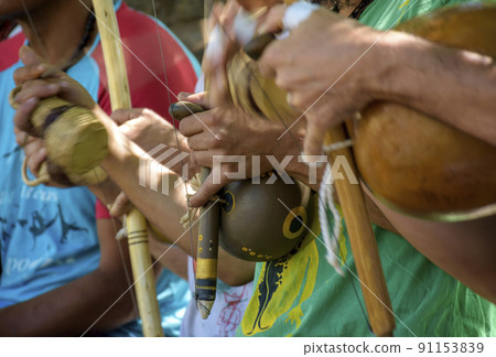 Berimbau players during presentation of Brazilian capoeira fight Berimbau players during presentation of Brazilian capoeira fight 91153839