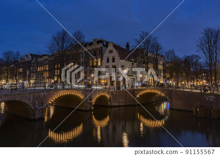 Amsterdam, Netherlands bridges and canals at twilight. Amsterdam, Netherlands bridges and canals at twilight. 91155567