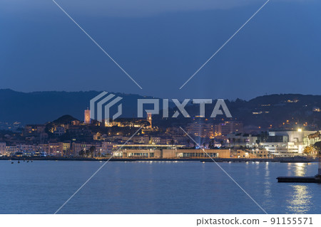 View of sea port in Cannes,France and its old town during the blue hour 91155571