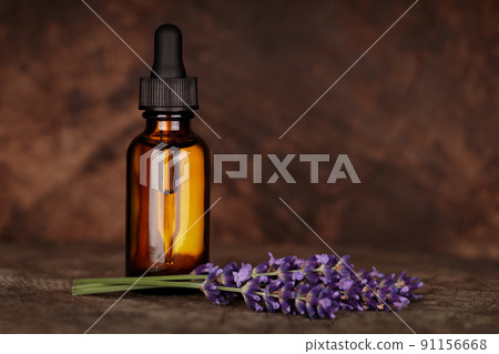 Lavender oil extract, lavender dropper and lavender flowers. Copyspace for text, mock. Alternative Medicine concept. 91156668