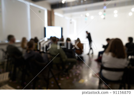 Blurred background of the business conference, one man on the stage, presentation of the project, public talk. High quality photo Blurred background of the business conference, one man on the stage, presentation of the project, public talk. High quality photo 91156870