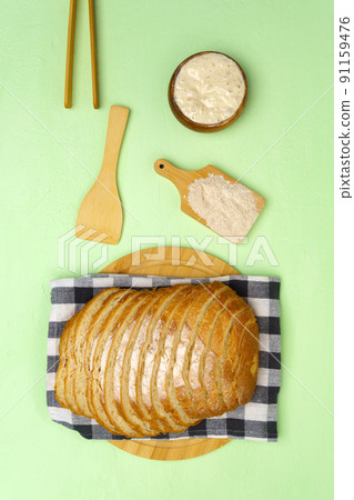 Bread without yeast. The concept of a healthy diet. Top view green background Bread without yeast. The concept of a healthy diet. Top view green background 91159476