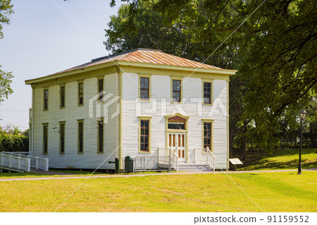 Sunny view of historical Renner School building in Old City Park Sunny view of historical Renner School building in Old City Park 91159552