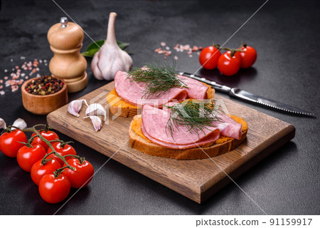 Delicious squash caviar sandwiches on a dark concrete background, healthy breakfast 91159917