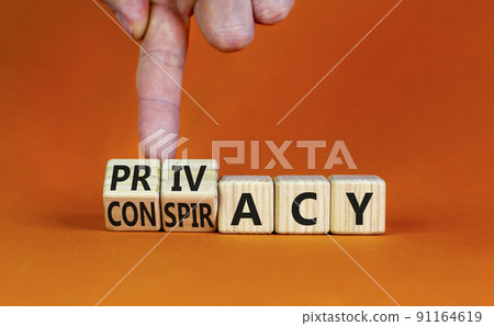 Privacy or conspiracy symbol. Businessman turns wooden cubes and changes the word Conspiracy to Privacy. Beautiful orange table orange background. Business privacy and conspiracy concept. Copy space. Privacy or conspiracy symbol. Businessman turns wooden cubes and changes the word Conspiracy to Privacy. Beautiful orange table orange background. Business privacy and conspiracy concept. Copy space. 91164619