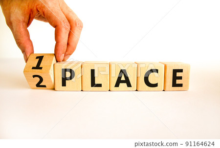 From 2 to 1 place symbol. Businessman turns wooden cubes and changes concept words 2 place to 1 place. Beautiful white table white background. Business and from 2 to 1 place concept. Copy space. From 2 to 1 place symbol. Businessman turns wooden cubes and changes concept words 2 place to 1 place. Beautiful white table white background. Business and from 2 to 1 place concept. Copy space. 91164624