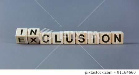 Symbol for a better inclusion. Inverted cube and changed word exclusion to inclusion. Beautiful grey background. Copy space. Symbol for a better inclusion. Inverted cube and changed word exclusion to inclusion. Beautiful grey background. Copy space. 91164660