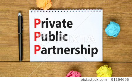 PPP private public partnership symbol. Concept words PPP private public partnership on white note on beautiful wooden background. Business PPP private public partnership concept. Copy space PPP private public partnership symbol. Concept words PPP private public partnership on white note on beautiful wooden background. Business PPP private public partnership concept. Copy space 91164696