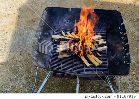 Bonfire using a bonfire at a campsite Bonfire using a bonfire at a campsite 91167919