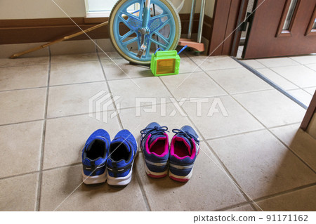 Children's shoes and play equipment placed at the entrance Children's shoes and play equipment placed at the entrance 91171162