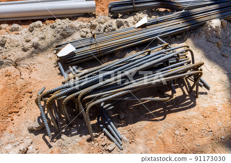 Rebar tie wire work at a construction site for rebar reinforcement Rebar tie wire work at a construction site for rebar reinforcement 91173030