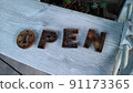 OPEN on a white chair 91173365