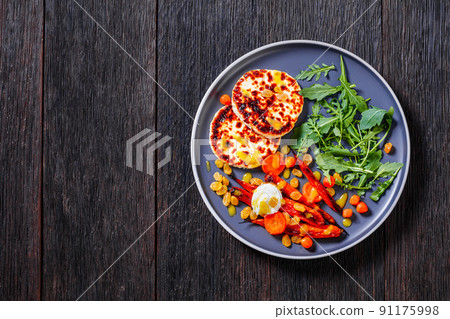 baby carrot salad and grilled halloumi cheese 91175998