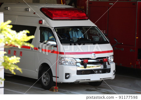 High-standard ambulance waiting before dispatch at the fire station 91177598