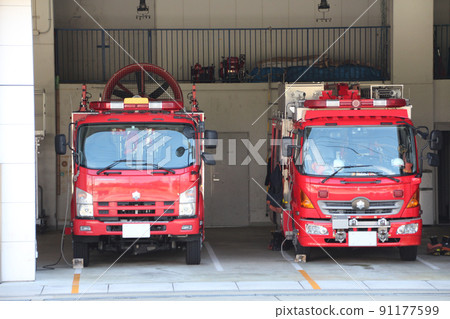 Special altitude work vehicle and rescue work vehicle type II fire engine waiting before dispatch at the fire station 91177599