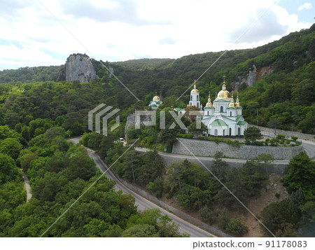 Christian church in the mountains above the sea. Temple of the Holy Archangel Michael in Oreanda. The southern coast of Crimea. Aerial view 91178083
