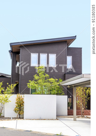Exterior and sky of a house with a carport Exterior and sky of a house with a carport 91180385