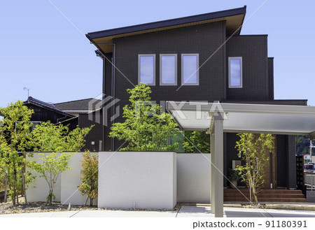 Exterior and sky of a house with a carport 91180391