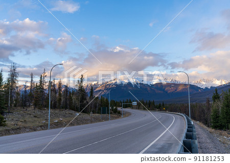 Trans-Canada Highway 16, Yellowhead Highway, Alberta Provincial Highway No. 16 in dusk. Canadian Rockies, Jasper National Park, Canada. 91181253