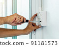 Install the electric power socket and switch in to a plastic outlet box on the wall. 91181573
