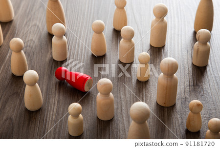 Bullying, workplace harass and loneliness concept. Wooden figurines on a desk. Bullying, workplace harass and loneliness concept. Wooden figurines on a desk. 91181720
