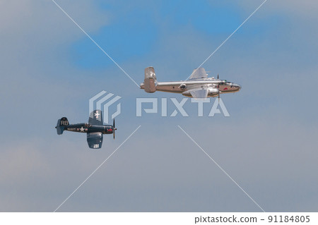 B-25J F4U-4 Corsair carrier-capable fighter escorting Mitchell bomber B-25J F4U-4 Corsair carrier-capable fighter escorting Mitchell bomber 91184805