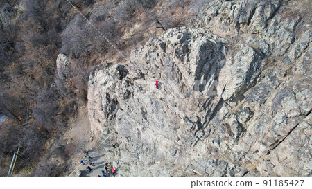 Rock climbing training on steep slope in mountains Rock climbing training on steep slope in mountains 91185427