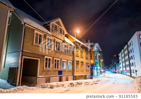 Traditional houses in Tromso at a winter night in Polar Norway Traditional houses in Tromso at a winter night in Polar Norway 91185583