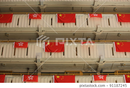 flags for celebrate the 25th anniversary of the establishment of the Hong Kong Special Administrative in Ping Shek Estate, Hong Kong 91187245