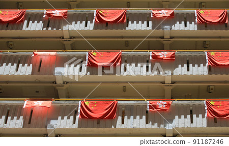 flags for celebrate the 25th anniversary of the establishment of the Hong Kong Special Administrative in Ping Shek Estate, Hong Kong 91187246