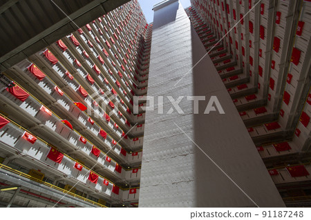 flags for celebrate the 25th anniversary of the establishment of the Hong Kong Special Administrative in Ping Shek Estate, Hong Kong 91187248