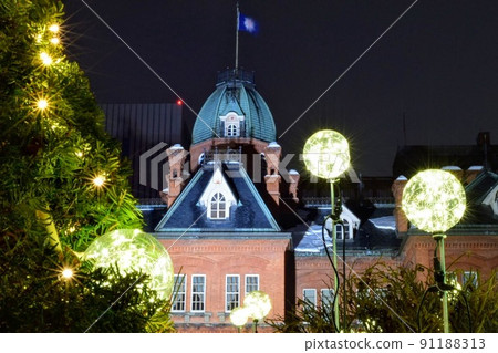 Brick building and moon-like illuminations in the night sky Brick building and moon-like illuminations in the night sky 91188313