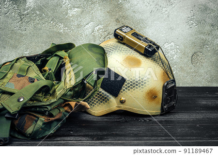 US military helmet on wooden background close up 91189467
