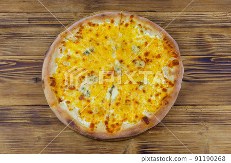Pizza Four cheese on a wooden background. Top view Pizza Four cheese on a wooden background. Top view 91190268