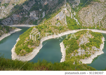 Meanders at rocky river Uvac gorge on sunny day, southwest Serbia. 91190307