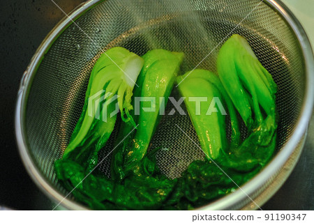 Spinach is being cooked Spinach is being cooked 91190347