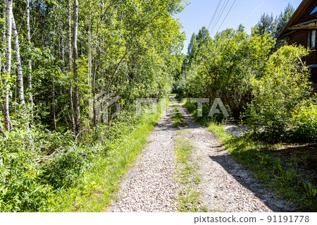 dirt road with ruts covered with gravel dirt road with ruts covered with gravel 91191778