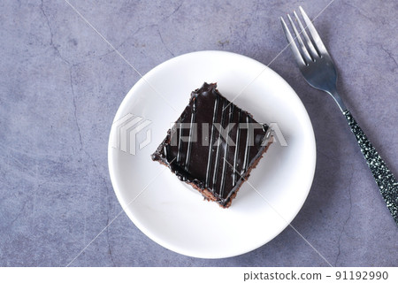 slice of brownie on plate on table slice of brownie on plate on table 91192990