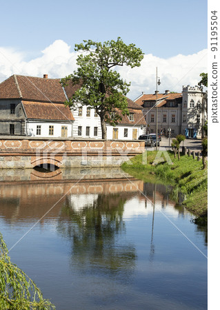 Reflection of a medieval house in the river, vertical frame, Kuldiga, Latvia. High quality photo Reflection of a medieval house in the river, vertical frame, Kuldiga, Latvia. High quality photo 91195504