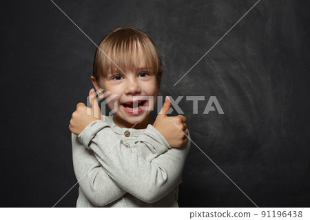 Funny child girl on blackboard background 91196438