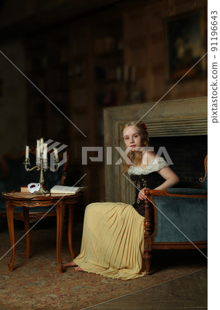Retro portrait of a attractive young woman in classic vintage dress Retro portrait of a attractive young woman in classic vintage dress 91196643