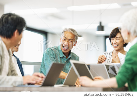 Lively middle-senior business person Lively middle-senior business person 91198462