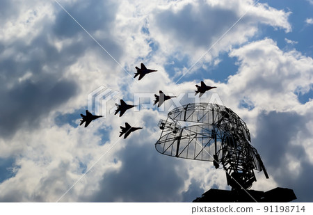 Air defense raiders of military mobile anti-aircraft complexes (radar is designed  and automatic tracking of targets and missiles) against the background of the flight of modern combat fighters,Russia 91198714