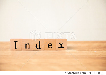 Index character. index. Written on five wooden blocks. Black letters. Wooden table and white wall background. 91198815